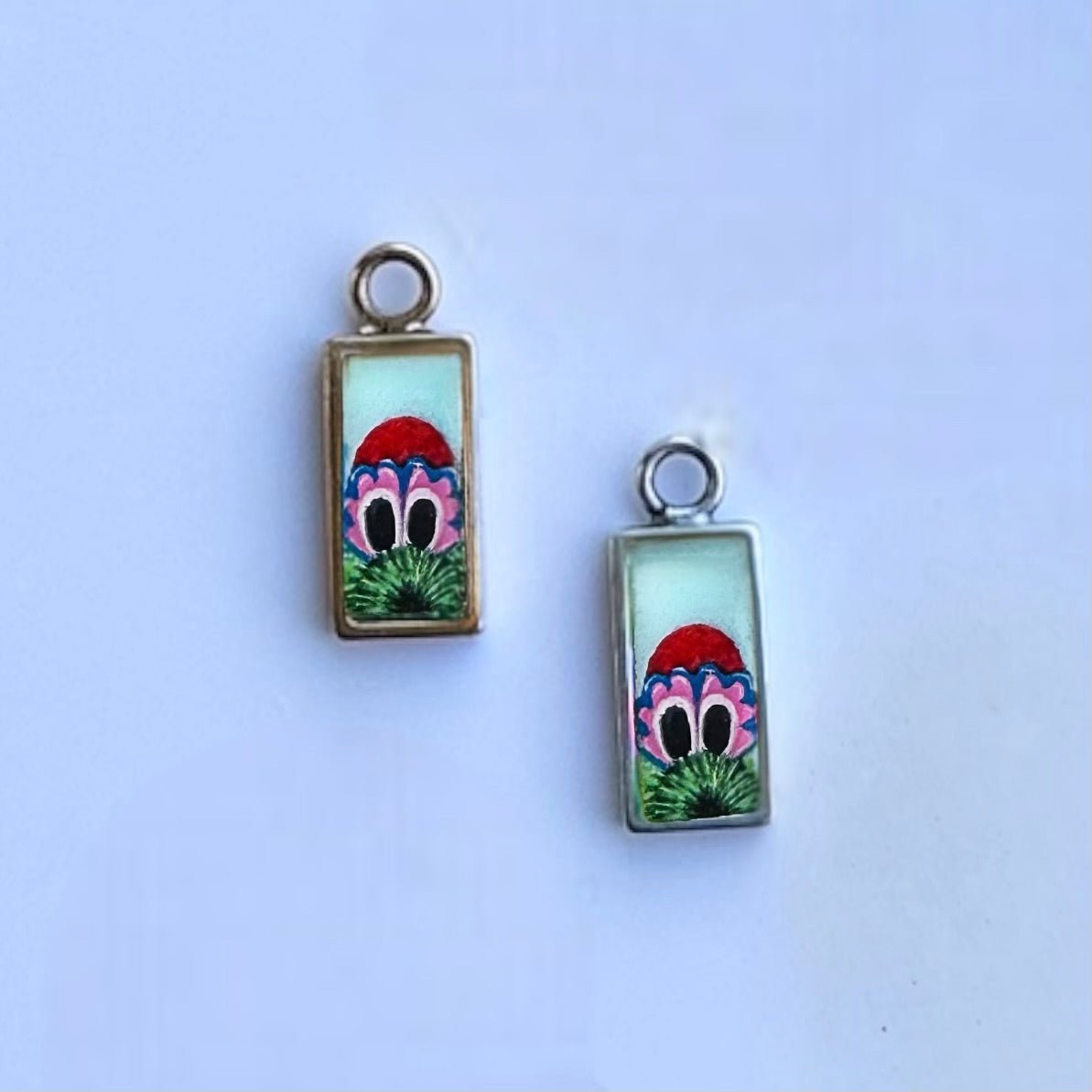Powder blue peeking Phanatic pendant on gold and silver comparison