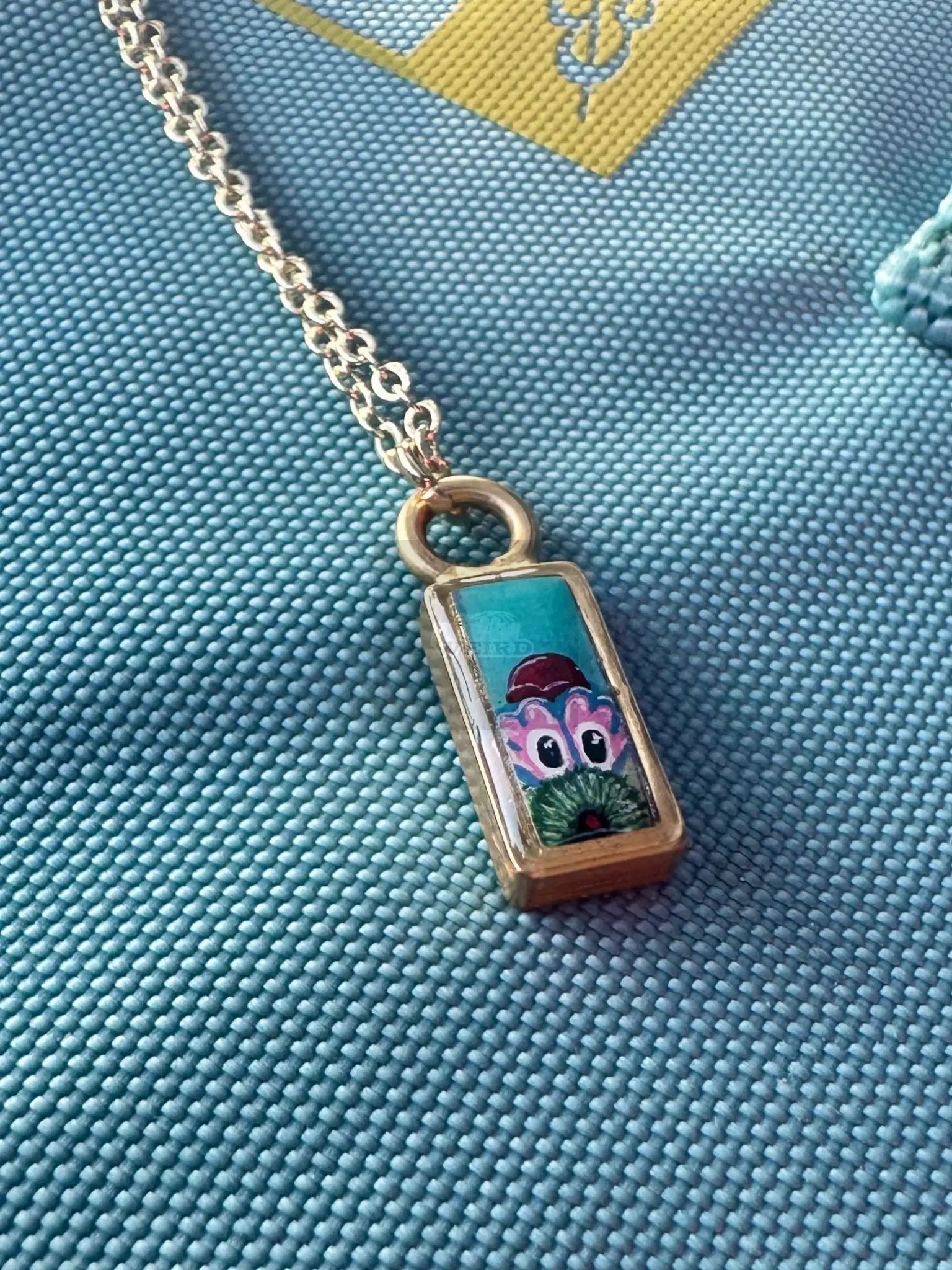 Baby Peeking Phanatic | Hand-Painted Pendant Necklace Pretty Weird